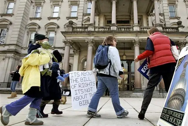 Photograph of people heading to the NJ Statehouse to hear debate about same sex marriage by Mel Evans/AP
